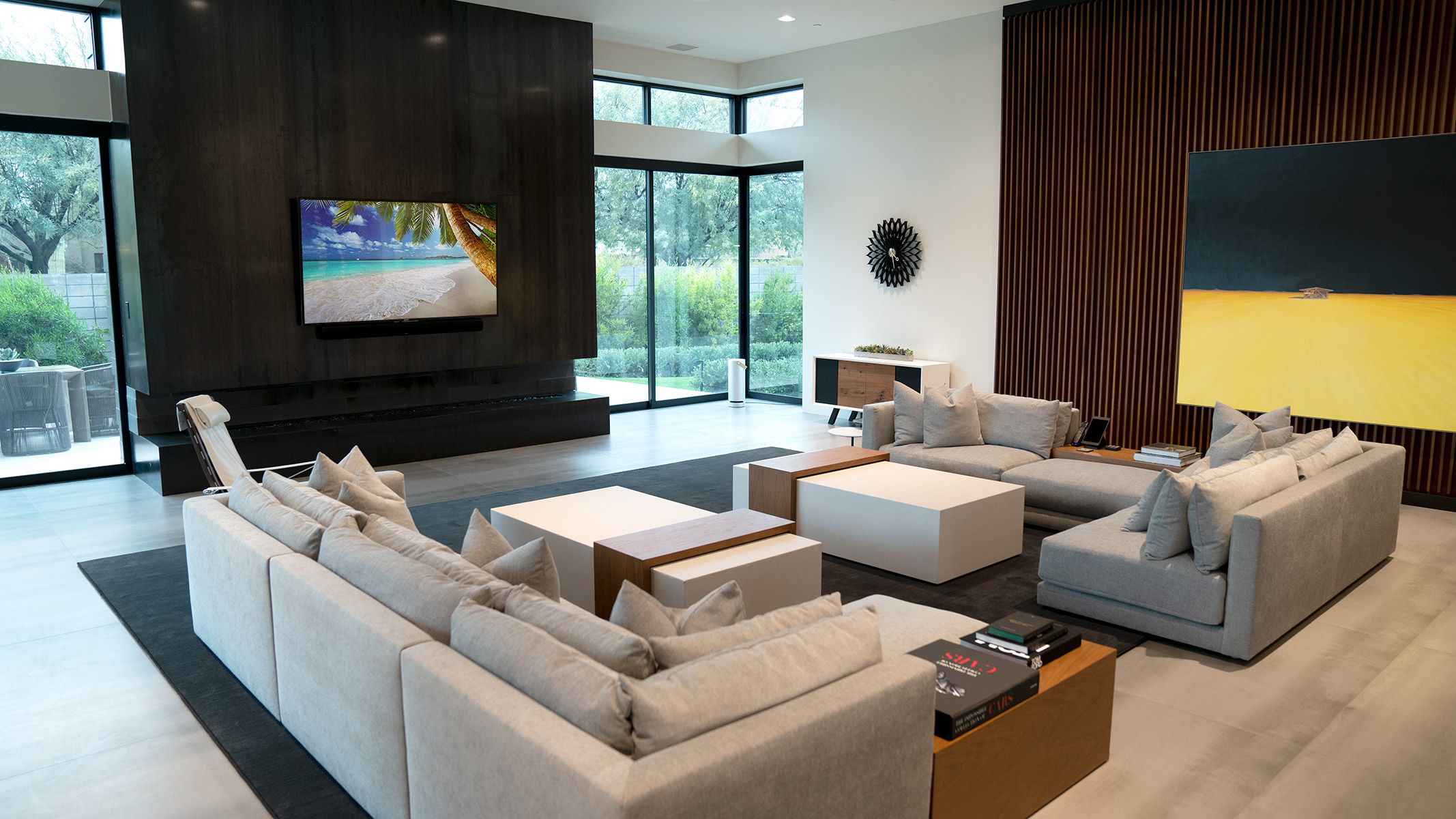 Modern living room with wall-mounted TV and home theater system